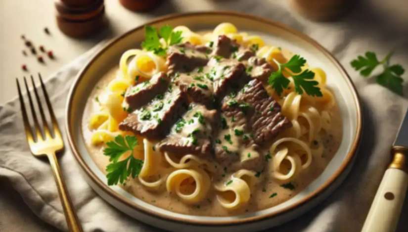 A creamy plate of beef stroganoff recipe served with tender beef slices, egg noodles, and fresh parsley garnish on a dinner table.